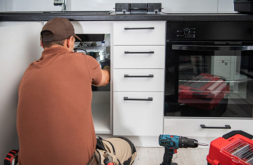technician installing kitchen equipment